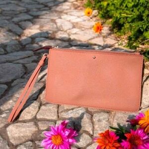 Kate Spade Saturday leather zip wristlet in salmon with polka dot interior